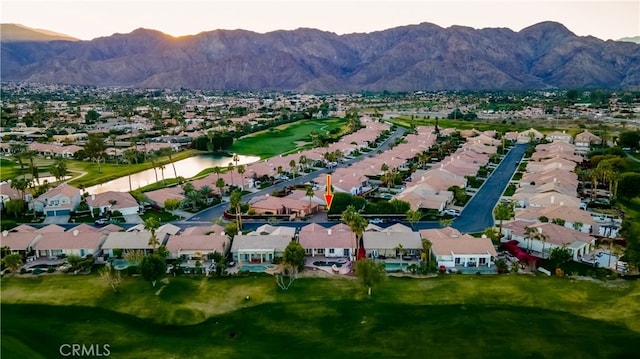 aerial view featuring a water and mountain view