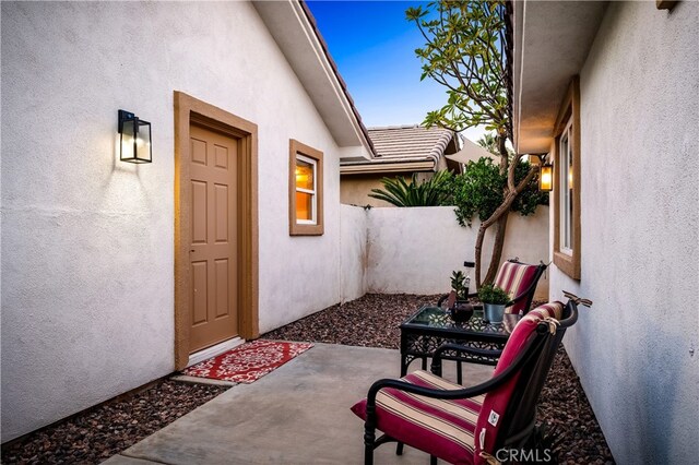 entrance to property with a patio