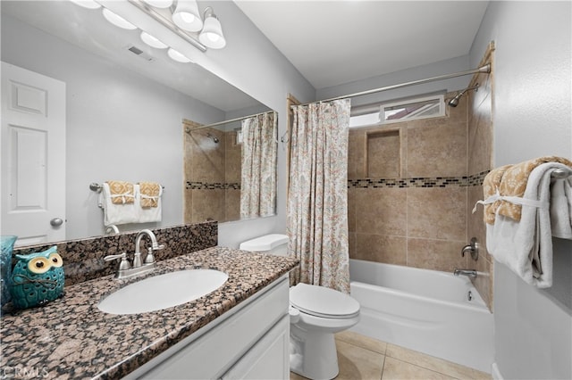 full bathroom with shower / bath combination with curtain, tile patterned floors, vanity, and toilet