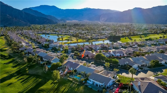 aerial view featuring a water and mountain view