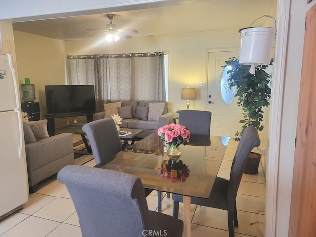 living room featuring ceiling fan and light tile patterned floors