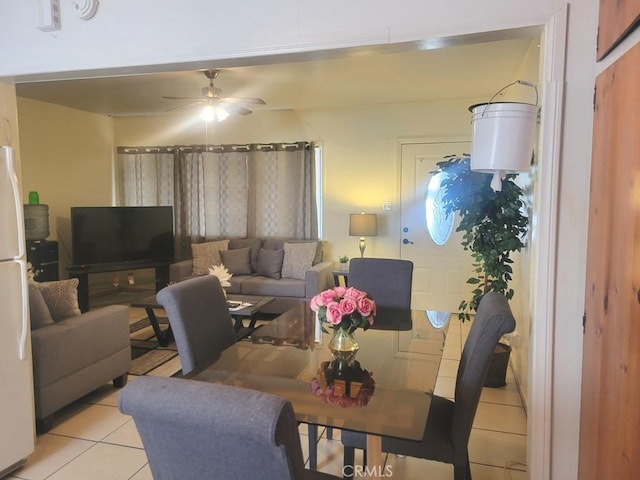 living room featuring ceiling fan and light tile patterned floors