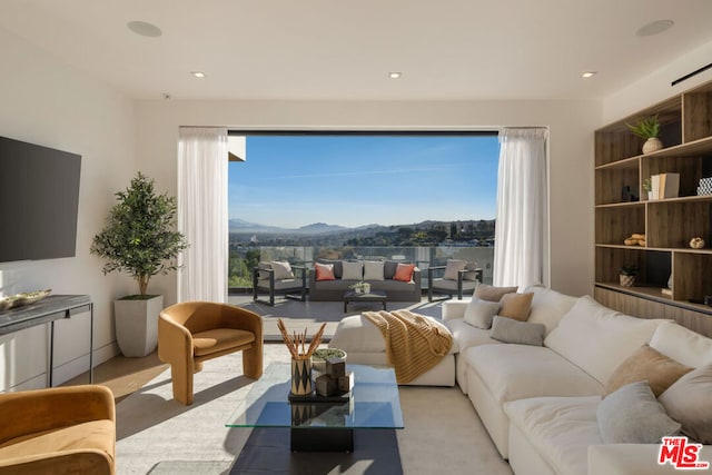 living room featuring a mountain view