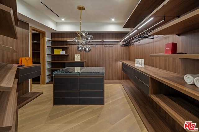 interior space with wooden walls and light wood-type flooring