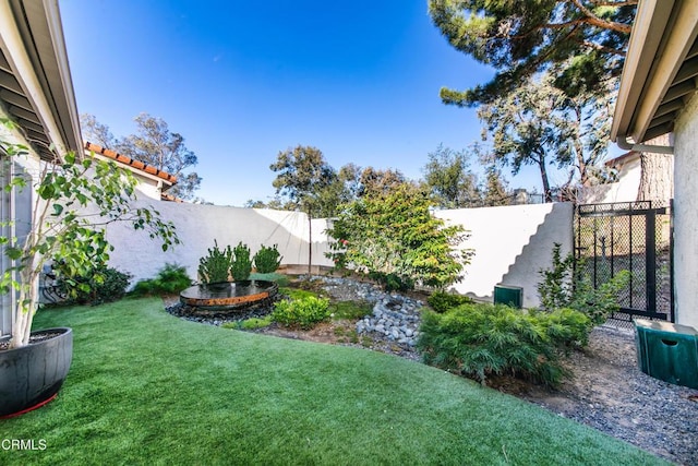 view of yard with a fenced backyard