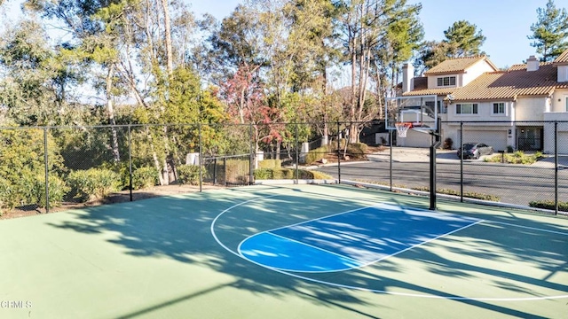 view of sport court featuring community basketball court and fence