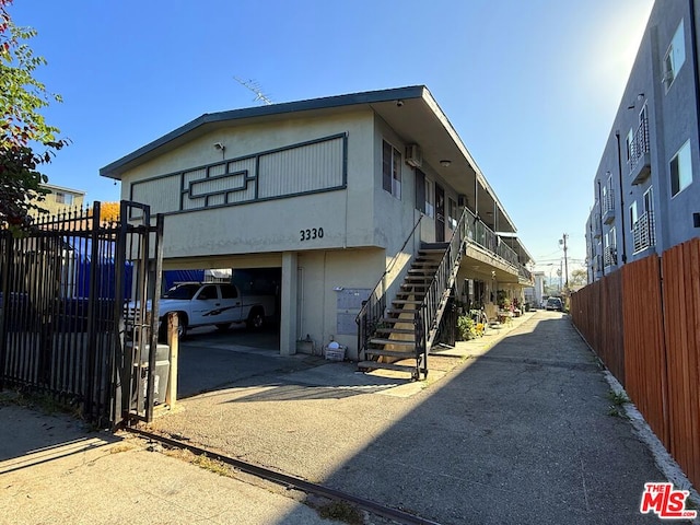 view of side of home featuring a garage