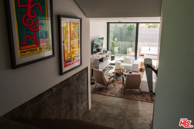 interior space with concrete flooring and expansive windows