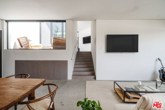 living room with concrete flooring