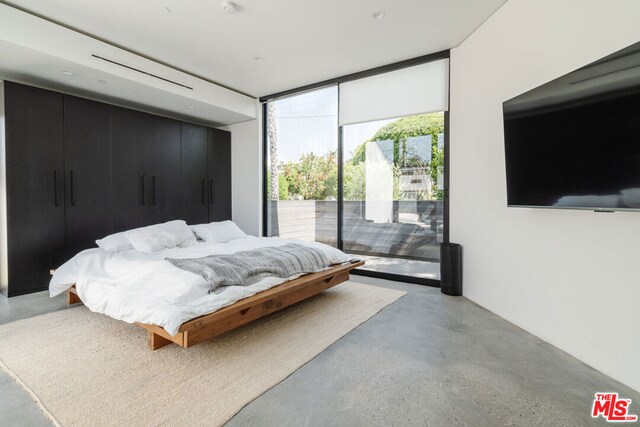 bedroom with a wall of windows