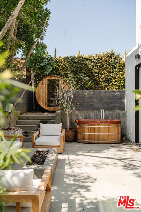 view of patio with a jacuzzi