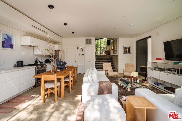 living room featuring expansive windows