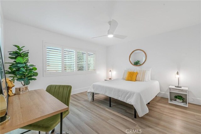 bedroom featuring ceiling fan and light hardwood / wood-style floors