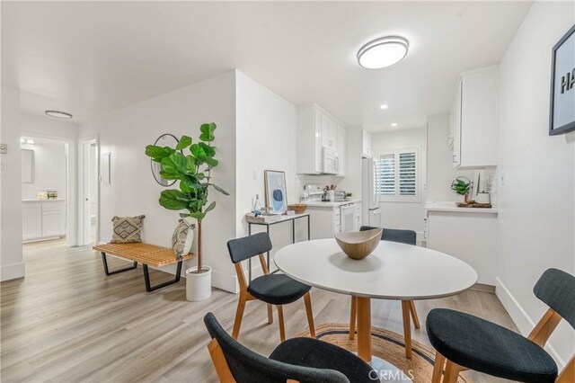 dining space featuring light hardwood / wood-style floors