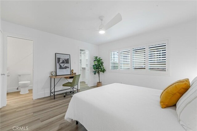 bedroom featuring ceiling fan, connected bathroom, and light hardwood / wood-style flooring