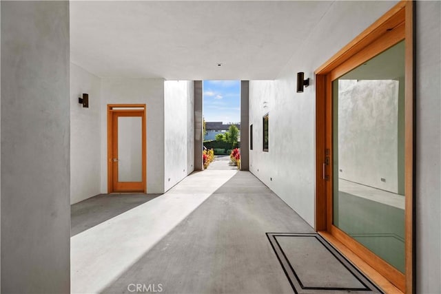 hallway with floor to ceiling windows