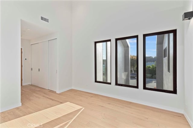 unfurnished room with light hardwood / wood-style floors