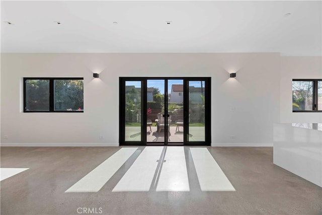 unfurnished room with french doors