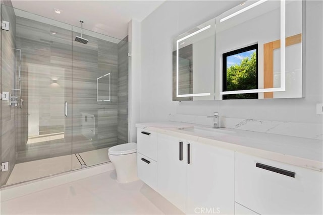 bathroom with walk in shower, tile patterned floors, vanity, and toilet