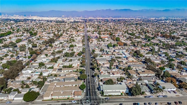 birds eye view of property featuring a mountain view