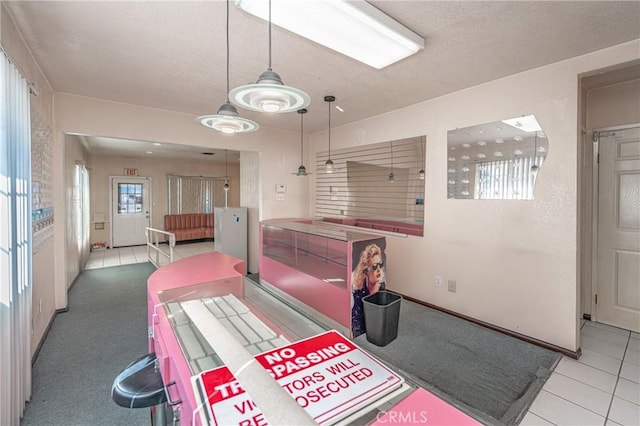 dining area featuring light tile patterned flooring and a wealth of natural light