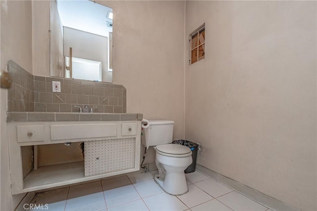 bathroom with tile patterned flooring and toilet