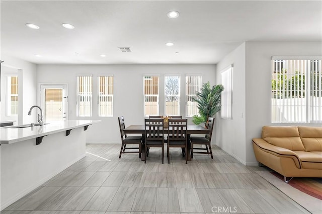 dining room featuring sink