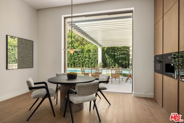 dining room featuring light hardwood / wood-style floors