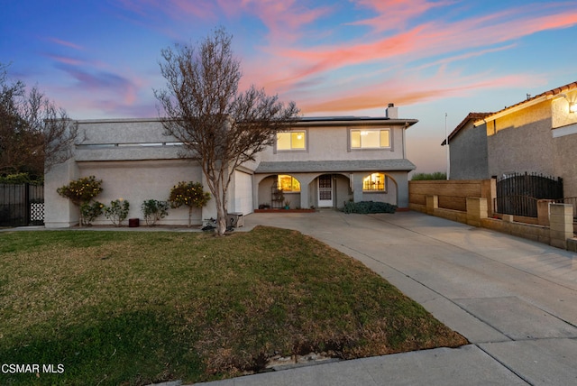 view of property featuring a lawn