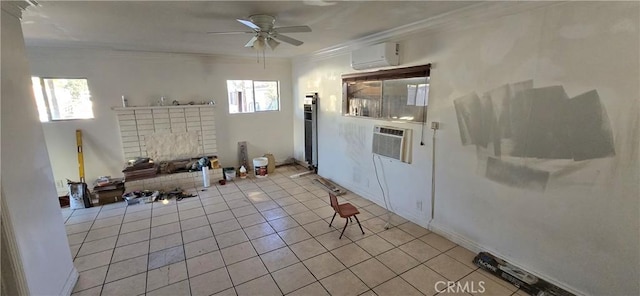 interior space featuring white cabinets, crown molding, ceiling fan, and a wall mounted air conditioner