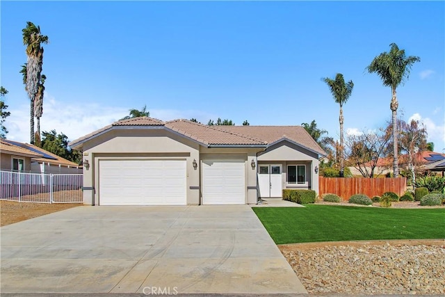 view of front facade featuring a front yard and a garage