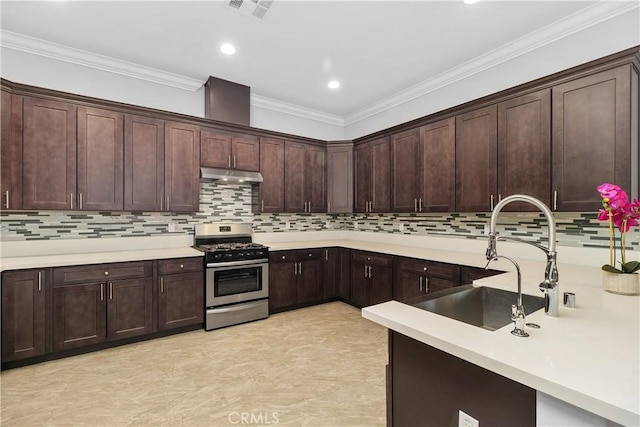 kitchen featuring sink, dark brown cabinets, crown molding, and stainless steel gas range oven