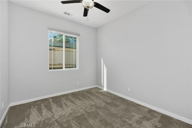 unfurnished room featuring ceiling fan and carpet floors