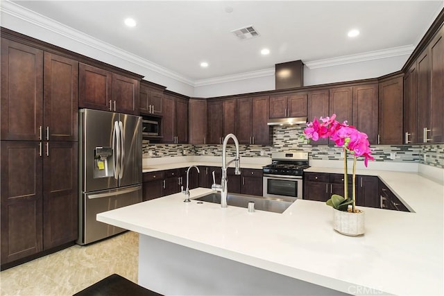 kitchen with stainless steel appliances, sink, dark brown cabinets, and crown molding