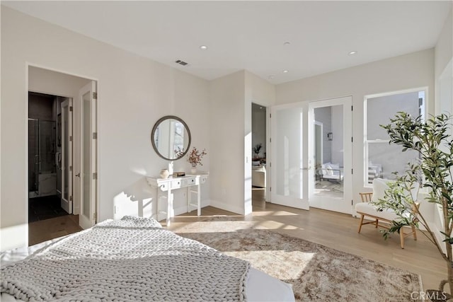 1700 Perkins Ln, Redondo Beach, CA 90278 - bedroom with wood finished floors, recessed lighting, connected bathroom, and french doors