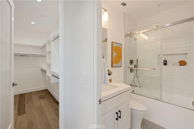 1700 Perkins Ln, Redondo Beach, CA 90278 - full bathroom with vanity, bath / shower combo with glass door, wood finished floors, recessed lighting, and a walk in closet