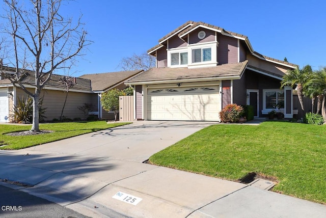 front facade with a garage and a front lawn