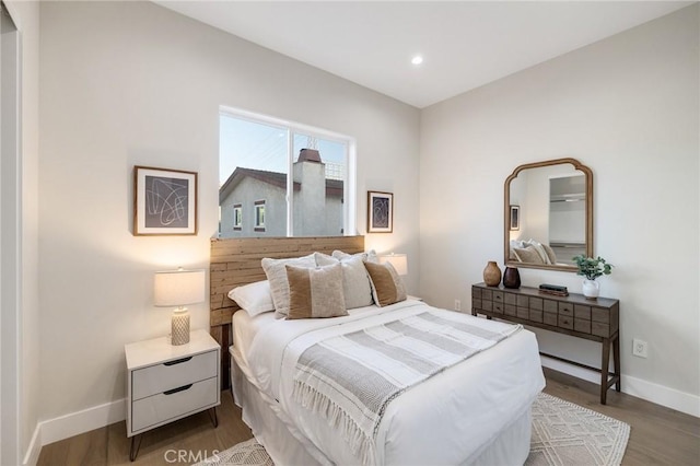 bedroom featuring hardwood / wood-style flooring