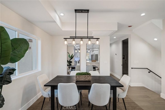 dining room featuring a healthy amount of sunlight and wood-type flooring