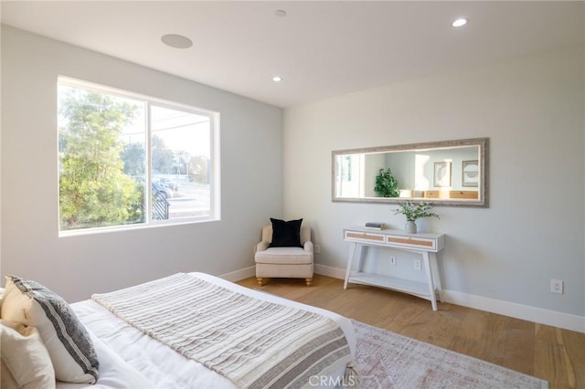 bedroom with light hardwood / wood-style floors