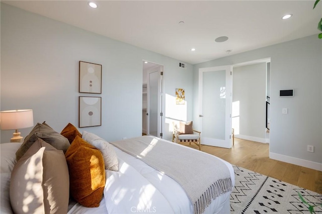 bedroom with light hardwood / wood-style flooring