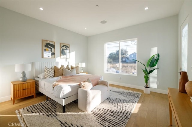 bedroom with light wood-type flooring