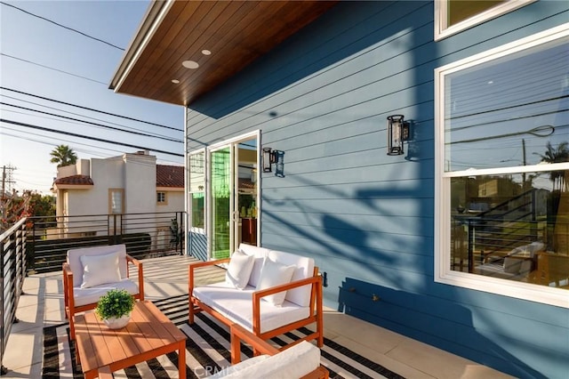 view of patio with a balcony and outdoor lounge area