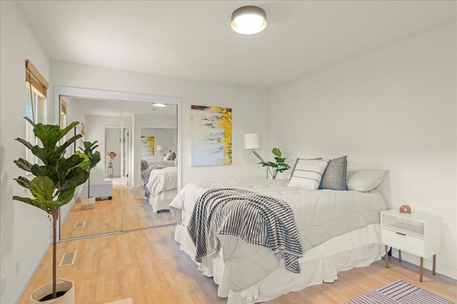 bedroom with light hardwood / wood-style floors