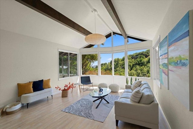 sunroom / solarium featuring vaulted ceiling with beams and a wealth of natural light