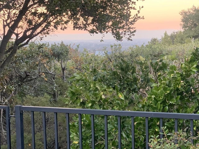 view of balcony at dusk