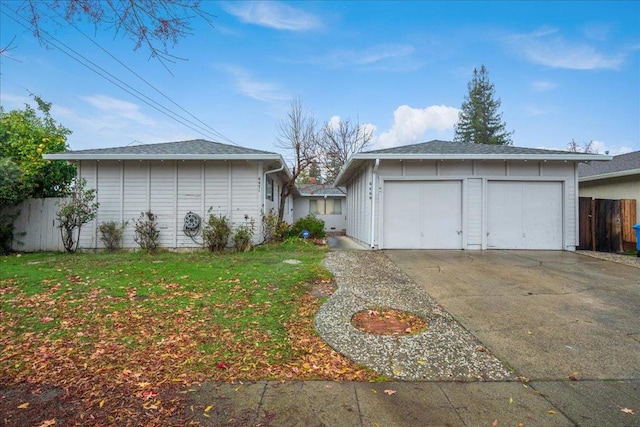 view of home's exterior with a lawn and a garage