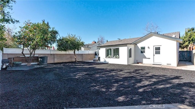 rear view of property featuring a patio area