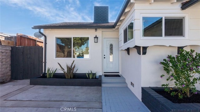 doorway to property with a patio