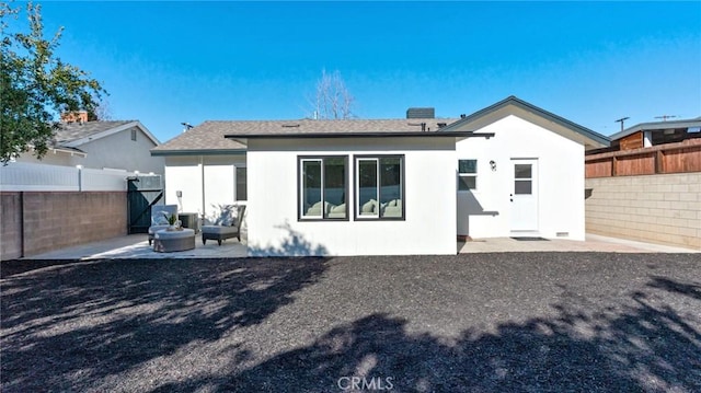 rear view of house featuring a patio